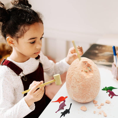 A kid digging into Dinosaur egg toy